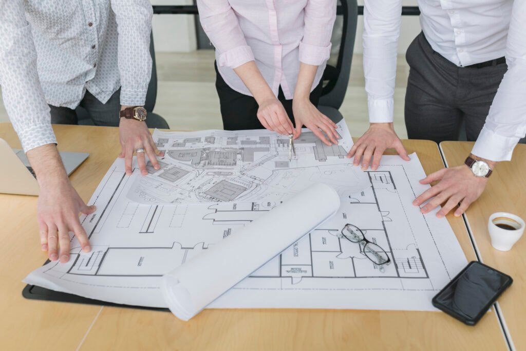 business people looking plans office